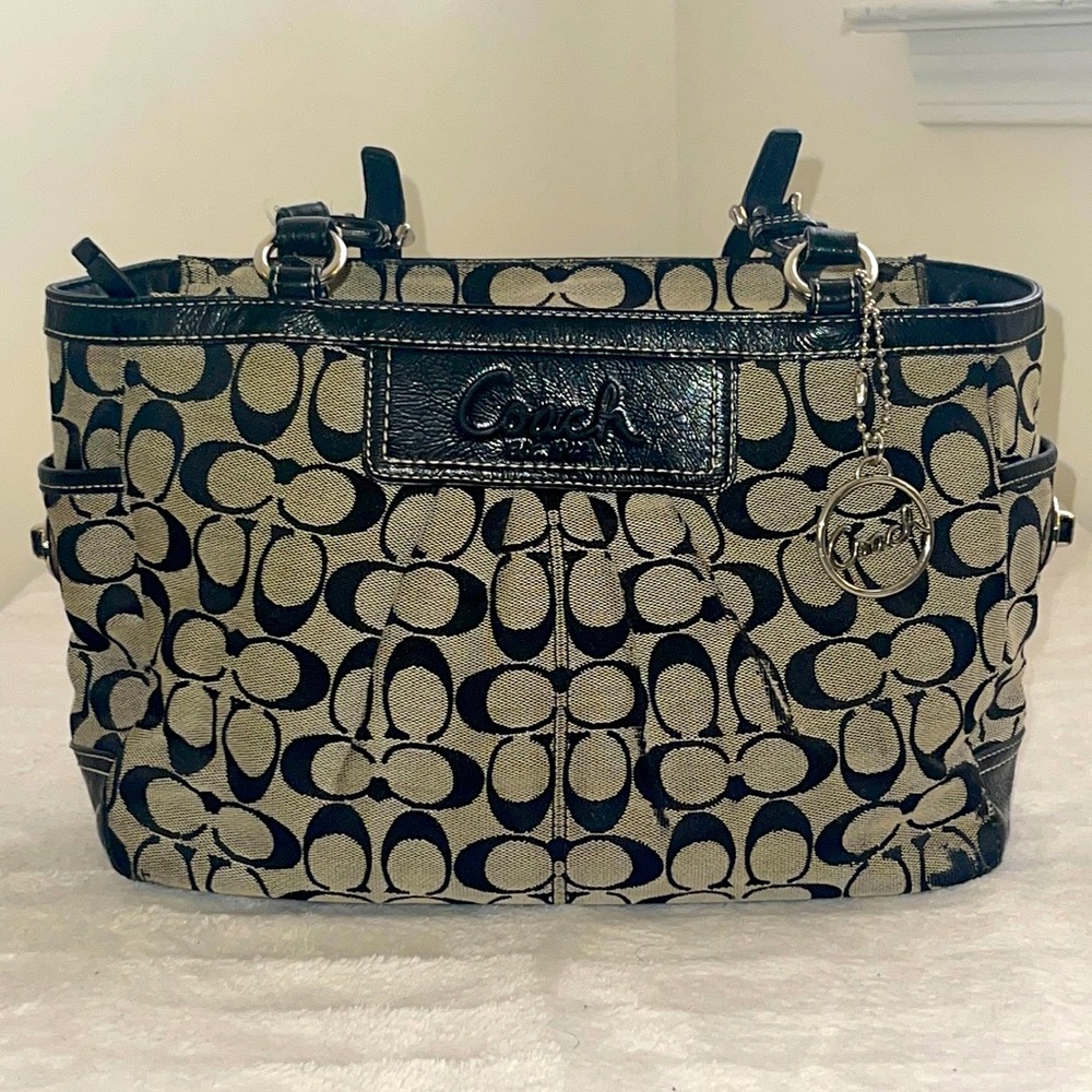 Coach black and cram colored purse